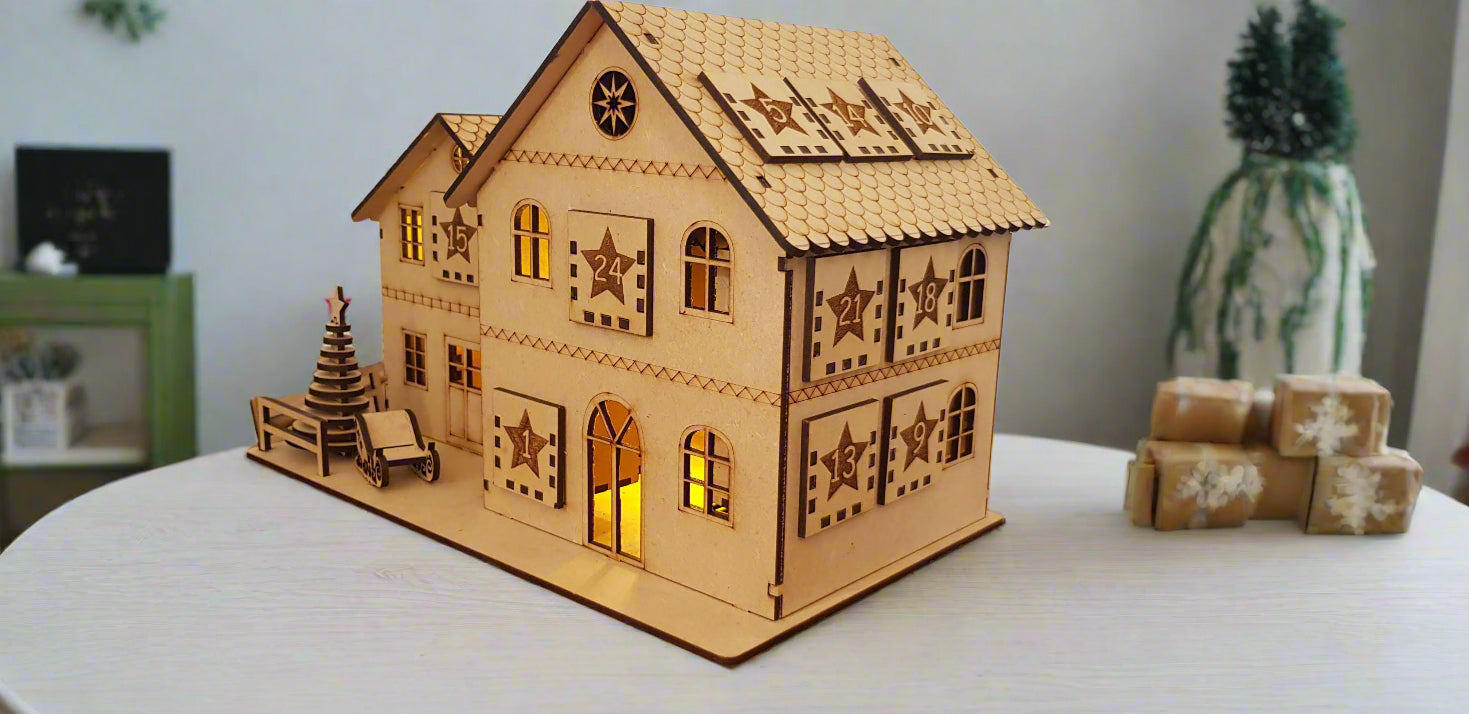 Wooden model house with decorative elements on a wooden surface