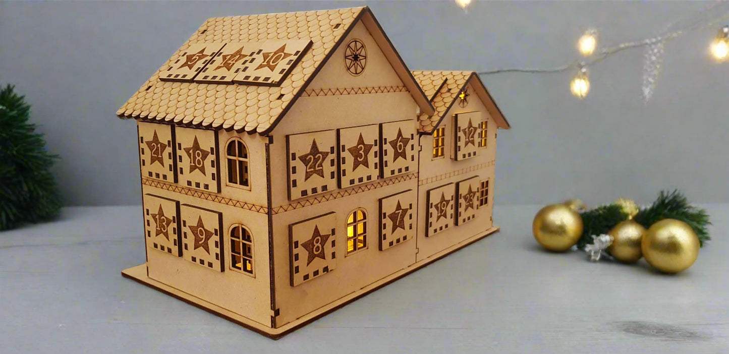 Wooden model of a house with decorative patterns on a wooden surface