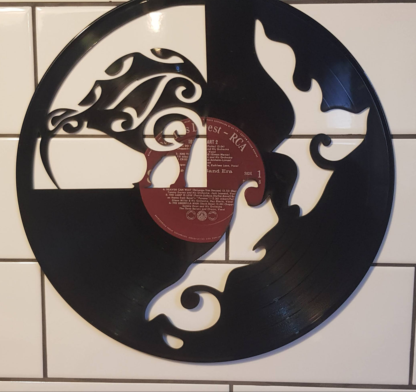 Decorative wall art made from a vinyl record with a New Zealand Map and Kiwi.