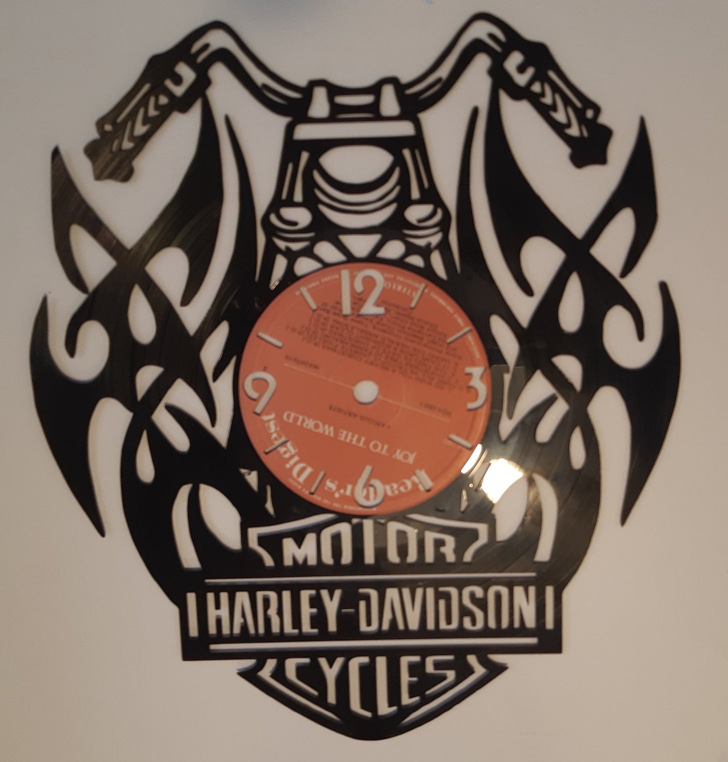 Decorative vinyl record with a harley davidson motorcycle design